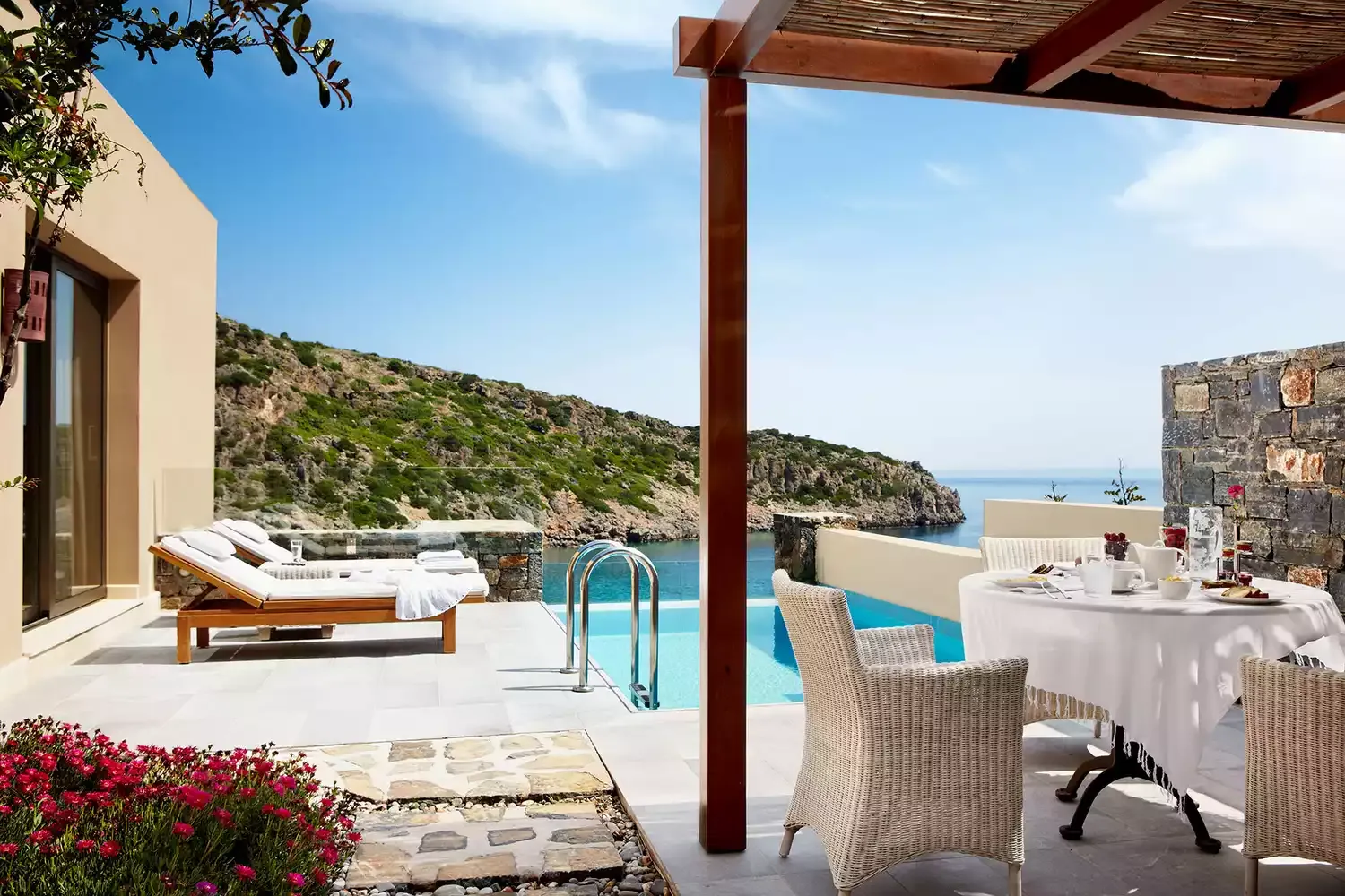 This Luxe Resort on the Largest Island in Greece Has a Stunning Private Beach — and Unreal Sea Views From Every Room