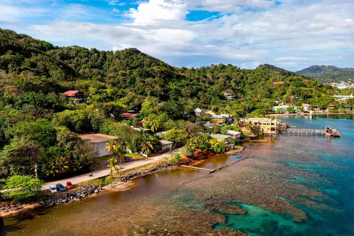 This Is the Perfect Adventure Itinerary for Roatán — With Scuba Diving, Waterfall Rappelling, and Even Some Relaxing Beach Time