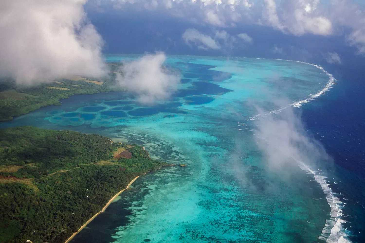 This Tiny, Remote Island You've Never Heard Of Has Tropical Forest Trails, 13-foot Coin Currency, and Some of the Most Turquoise Waters in the World