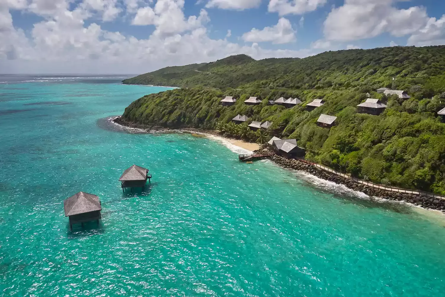 This Caribbean Resort Has 2 New Stunning Overwater Bungalows for a Dreamy Spa Experience