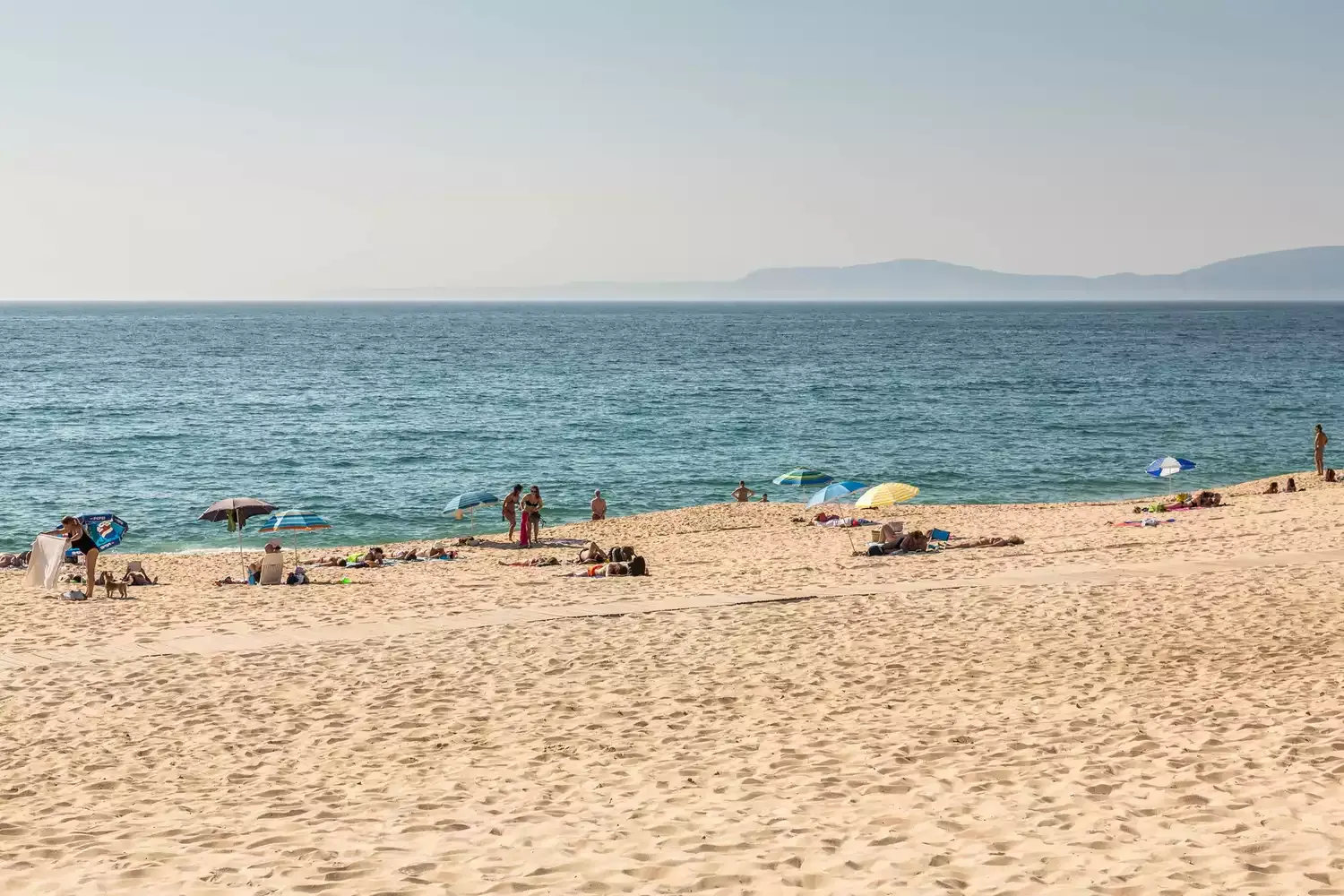 This Charming Beach Town Is Called the 'Hamptons of Portugal' — and It's Home to a Massive Flock of Flamingos