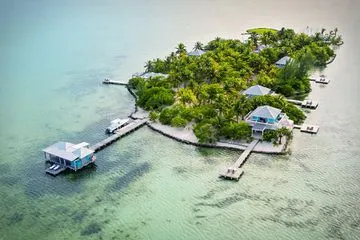 This Private Island Has 7 Stunning Villas — Including One of the Only Overwater Bungalows in Belize