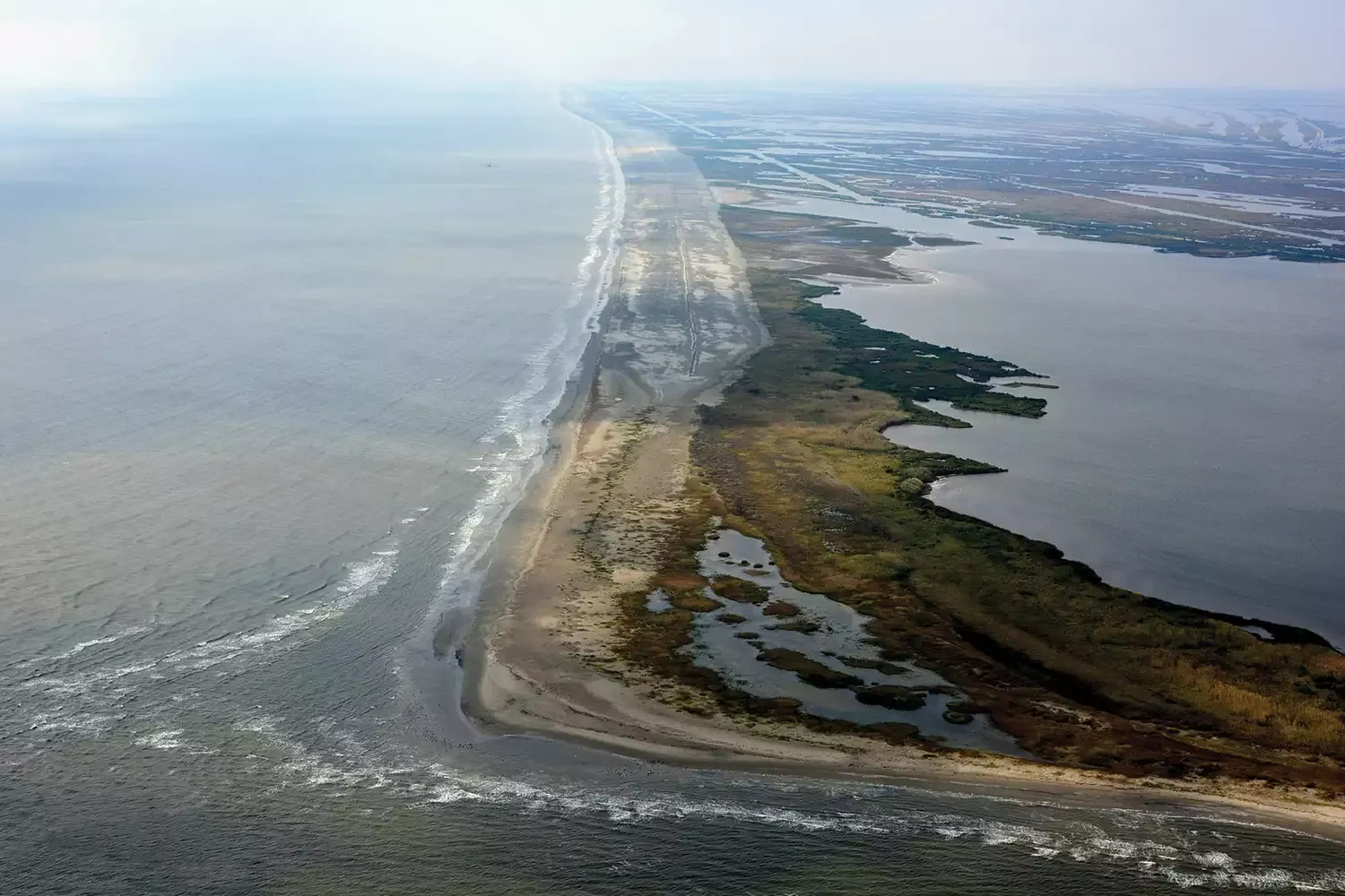 This Tiny Island in Louisiana Is Made for Warm-weather Getaways Thanks to Its Fresh Seafood, Birdwatching, and Stunning Beaches